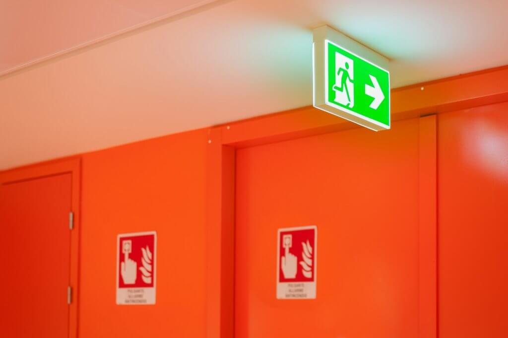 Bright green safety exit signal.